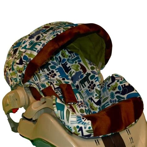 (not intended for use with autobaby (europe only) and assura infant car • push stroller canopy back, and rotate restraint latches until they snap the infant car seat into place. Graco Snugride Custom Replacement Infant Car Seat Cover ...