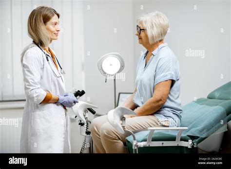 Senior Woman Sitting On The Gynecological Chair During A Medical Consultation With Gynecologist