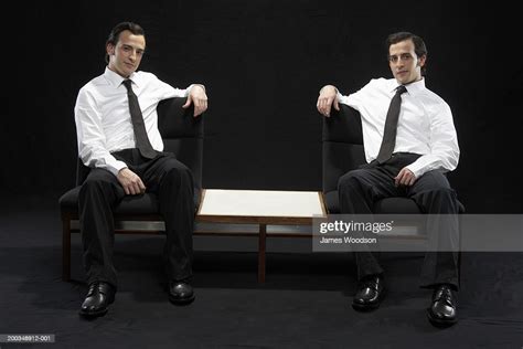 Twin Brothers Sitting On Chairs Wearing Suits Portrait Photo Getty Images