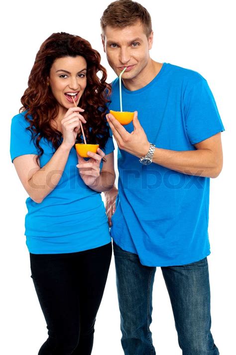Young Couple Drinking Orange Juice Together Stock Image Colourbox