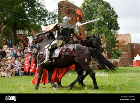 Medieval Cavalry Knights On Military Horses Fighting With Swords Taken