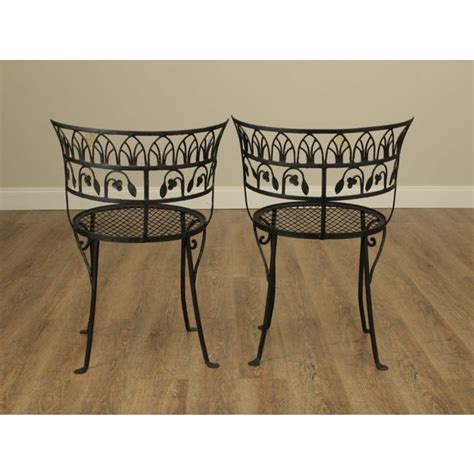 The glass top has gone missing. Salterini Vintage Wrought Iron Pair Curved Back Garden Chairs | Chairish