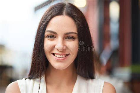 Headshot Of Pleasant Looking Charming Smiling Young Woman With Healthy