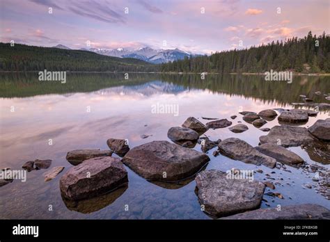 Sunrise On A Beautiful Reflective Lake In The Canadian Rockies Jasper