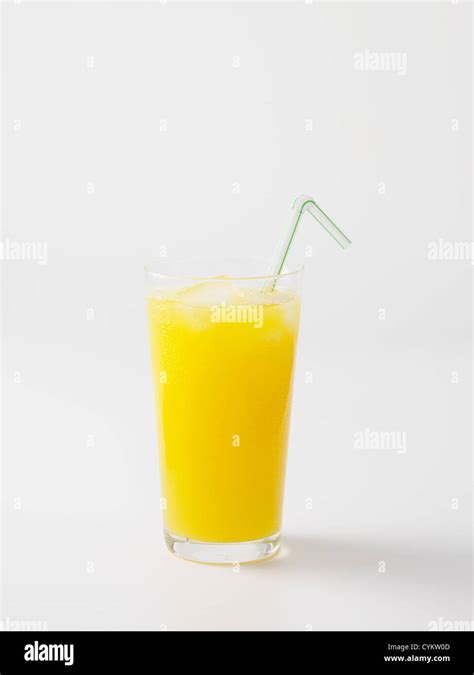 Straw In Glass Of Orange Juice Stock Photo Alamy