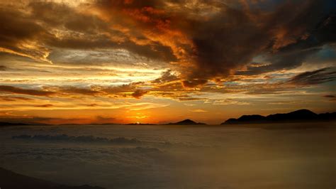 Download Wallpaper 1366x768 Mountains Sunset Clouds Sky Tablet