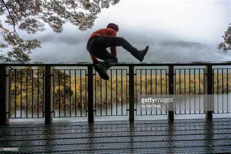 Concept A Man Jumping Over Fence Set Amids Foggy Background Male Poses Fence Ap Drawing