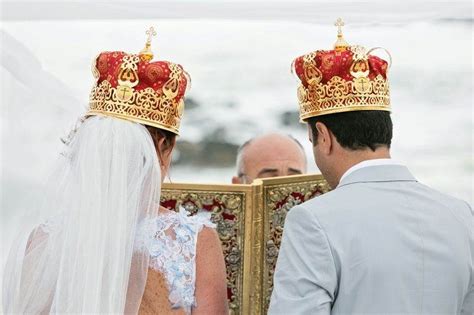 The Bride And Groom Are Looking At Each Other In Front Of An Ornate