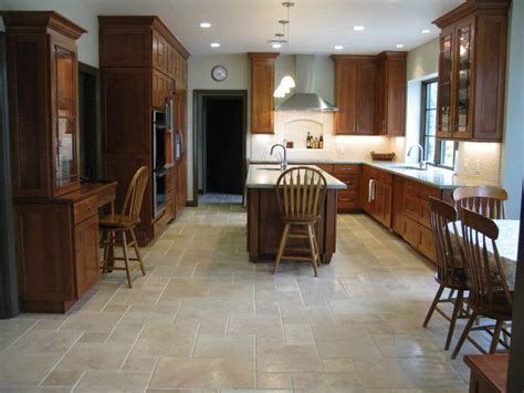 The white stone flooring works perfectly against the white and black wood on your cabinets and kitchen island. Travertine Kitchen Floor Design Ideas, Cost and Tips ...