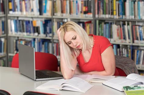 Premium Photo Young Woman Student Feel Bored While Trying To Studying