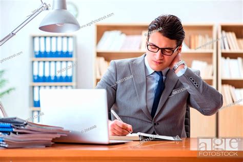 Businessman Feeling Pain In The Office Stock Photo Picture And