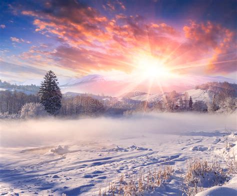 Beautiful Winter Sunrise In Mountain Village Stock Photo
