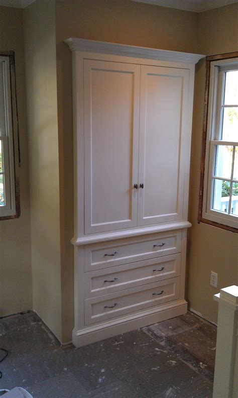 This compact closet is designed to hold linens. Built in armoire for master bedroom, but running the ...