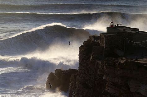 Photos Massive Waves Tempt Surfers Off Portugals Coast Komo