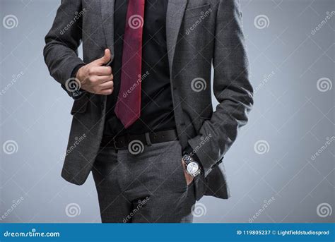 Cropped Image Of Businessman Holding Side Of Jacket And Hand In Pocket