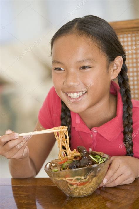 Learn about chinese food with free interactive flashcards. Young girl in dining room eating chinese food smiling ...