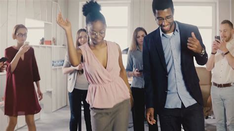 Happy African American Friends Doing Ethnic Dance At Office Party