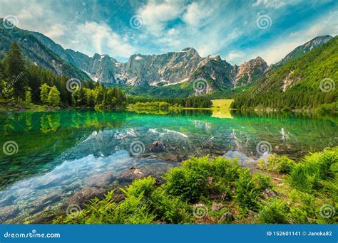 Alpine Landscape With Lake Fusine And Mount Mangart Italy Stock Image