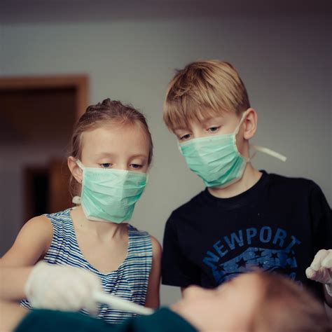 Two Children Wearing Surgical Masks · Free Stock Photo