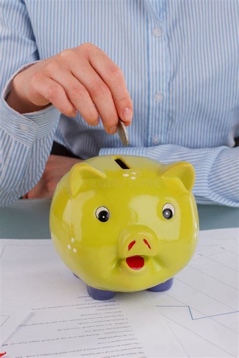 Female Hand Putting Coin Into Piggy Bank Stock Image Image Of