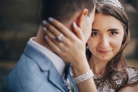 Portraits Of Beautiful Sensual Wedding Couple Gently Hugging In European City Stylish Bride And