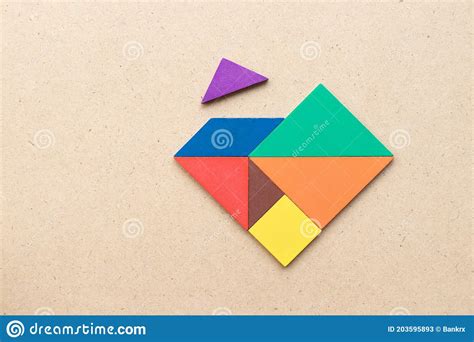 Color Tangram Wait For Fulfill To Heart Shape On Wood Table Stock Image