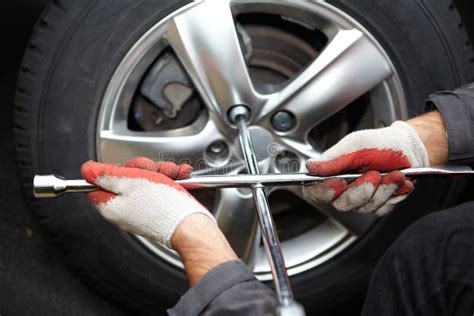 Car Mechanic Changing Tire Stock Photo Image Of Spare Manual