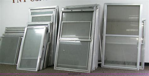 27 Assorted Aluminum Storm Windows With Screens In Coffeyville Ks