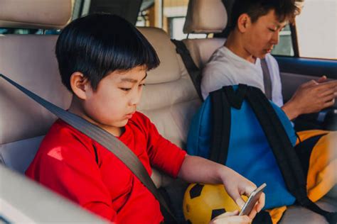 Asian Kid In Backseat Stock Photos Pictures And Royalty Free Images Istock