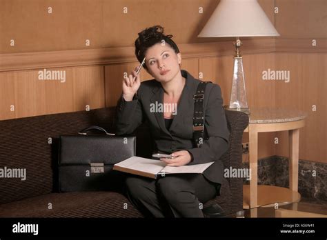 Woman In Waiting Room Or Hotel Lobby Stock Photo Alamy
