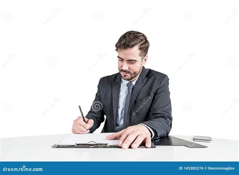 Business Man In Suit Signing A Contract Or Some Papers Stock Photo