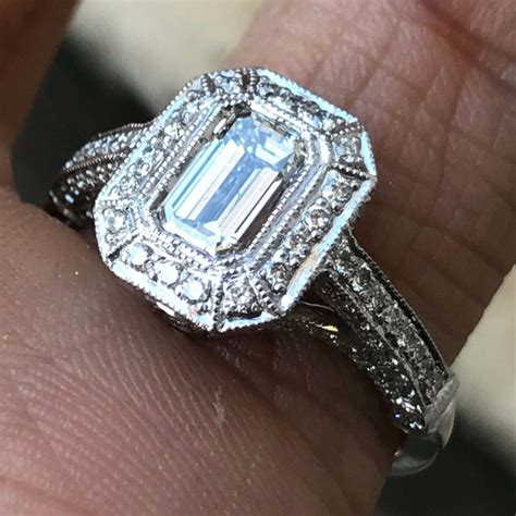 Platinum with a colored gem emerald cut carrie ring. Emerald Cut Diamond Engagement Ring, 1.70 Carat, H SI1 Platinum GIA For Sale at 1stdibs