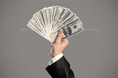 Business Mans Hand To Holding Money Handful Of Dollars Male Hands