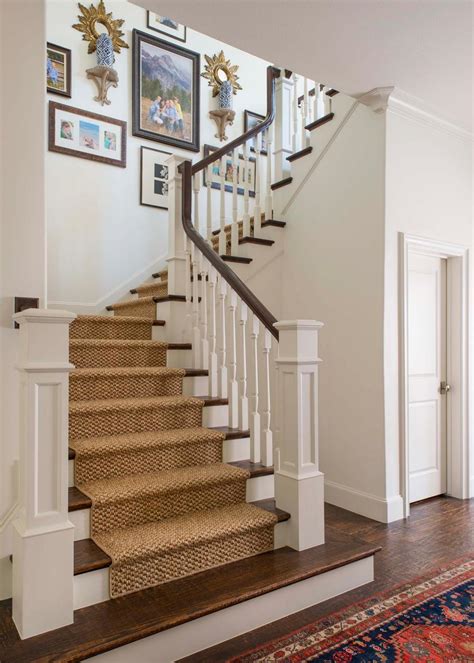 Traditional Staircase With White Balusters And Newel Post Framing Wood