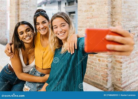 Three Multiracial Young Friends Having Fun Taking Self Portrait With