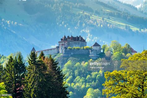 The Medieval Castle Of Gruyeres In The Spring Morning Light With Swiss