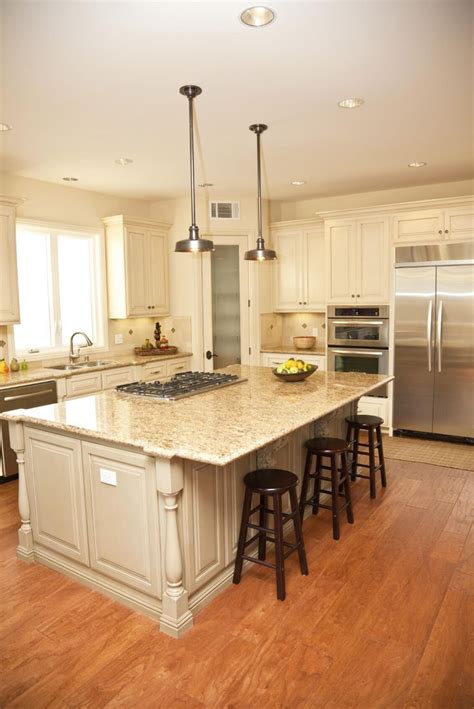 A Large Kitchen With An Island In The Middle