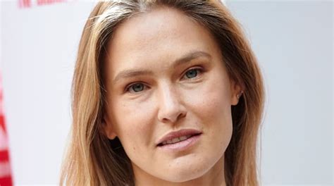 Bar Refaeli Elevates Her Simple One Piece With An Elegant White Button