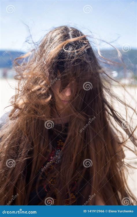 Brunette Girl With Long Hair Flying In The Wind Stock Photo Image Of