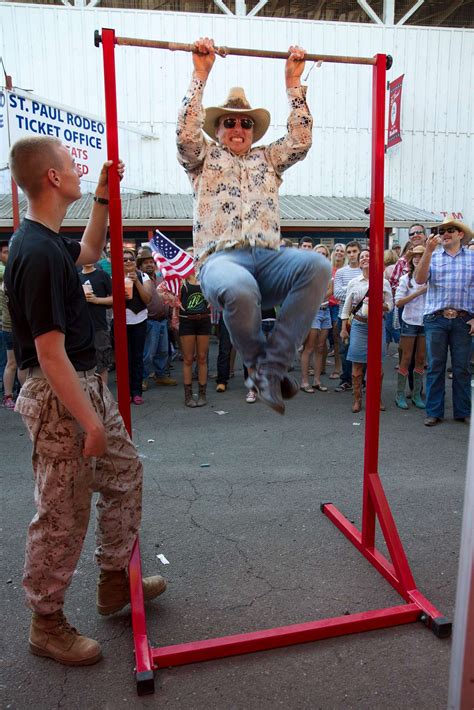 Rodeo Attendees Attempt Pull Ups During A Marine Corps Us National