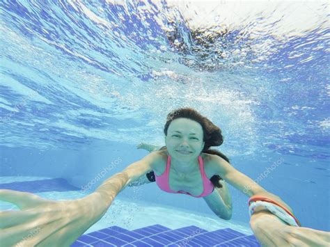 Woman Swimming Underwater In Pool Smiling Stock Photo By Peppersmint