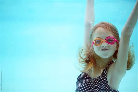 View Girl Swimming Underwater Wearing Goggles By Stocksy Contributor