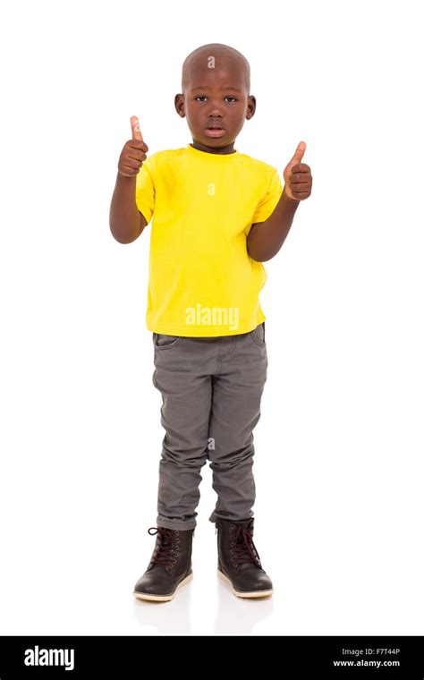 African American Boy Giving Thumbs Up On White Background Stock Photo