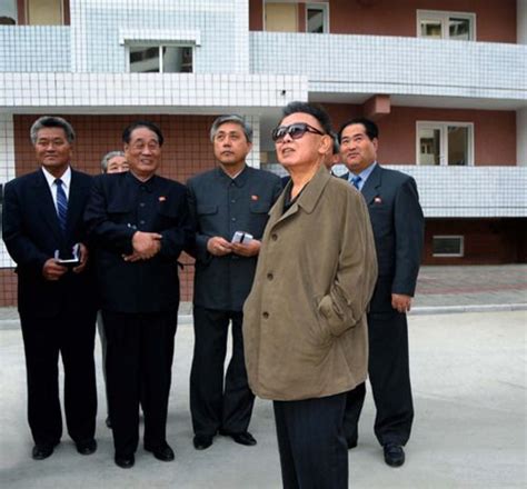 Kim Jong Il Looking At Apartment Buildings Homens