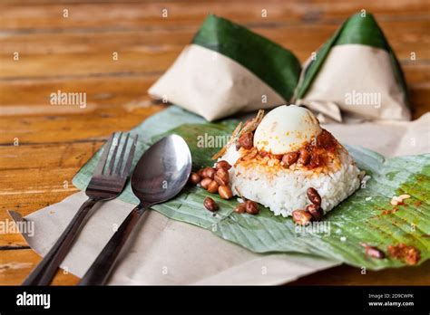 Simple Authentic Nasi Lemak Wrapped In Banana Leaf For Breakfast Stock