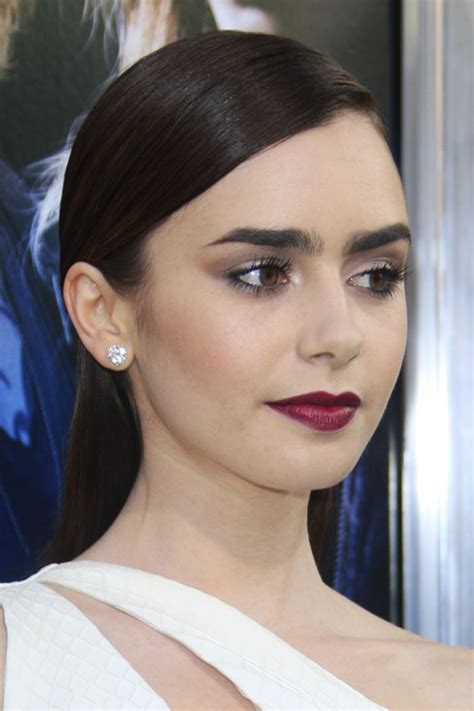 Lily Collins Straight Dark Brown Flat Ironed Slicked Back Hairstyle