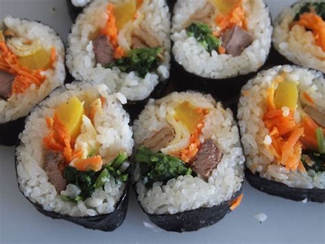 This recipe uses fresh cucumber instead of spinach, bulgogi seasoned ground beef and healthy burdock roots. A Bite of Kimbap (Korean Seaweed Rice Roll) - Noms 'n Bites