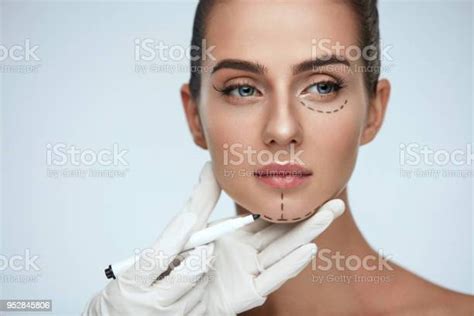 Treatment Beautician Drawing Surgical Lines On Woman Face Stock Photo