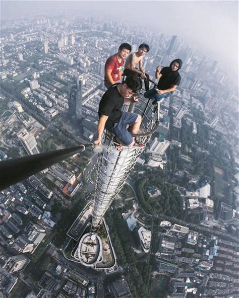 Four Men Take Selfies On Top Of 450 Meter High Building Shine News