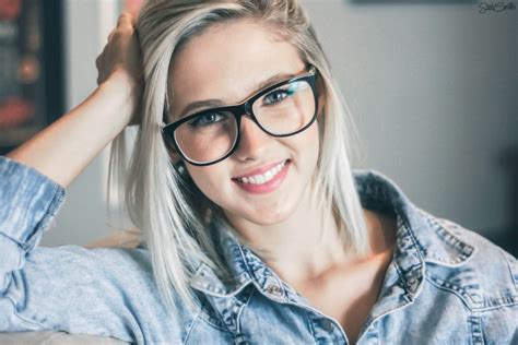 A Nice Young Blonde Woman In Dark Rimmed Glasses Myconfinedspace